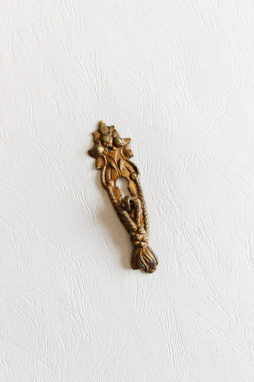 antique french gilt metal keyhole escutcheon with drop pull