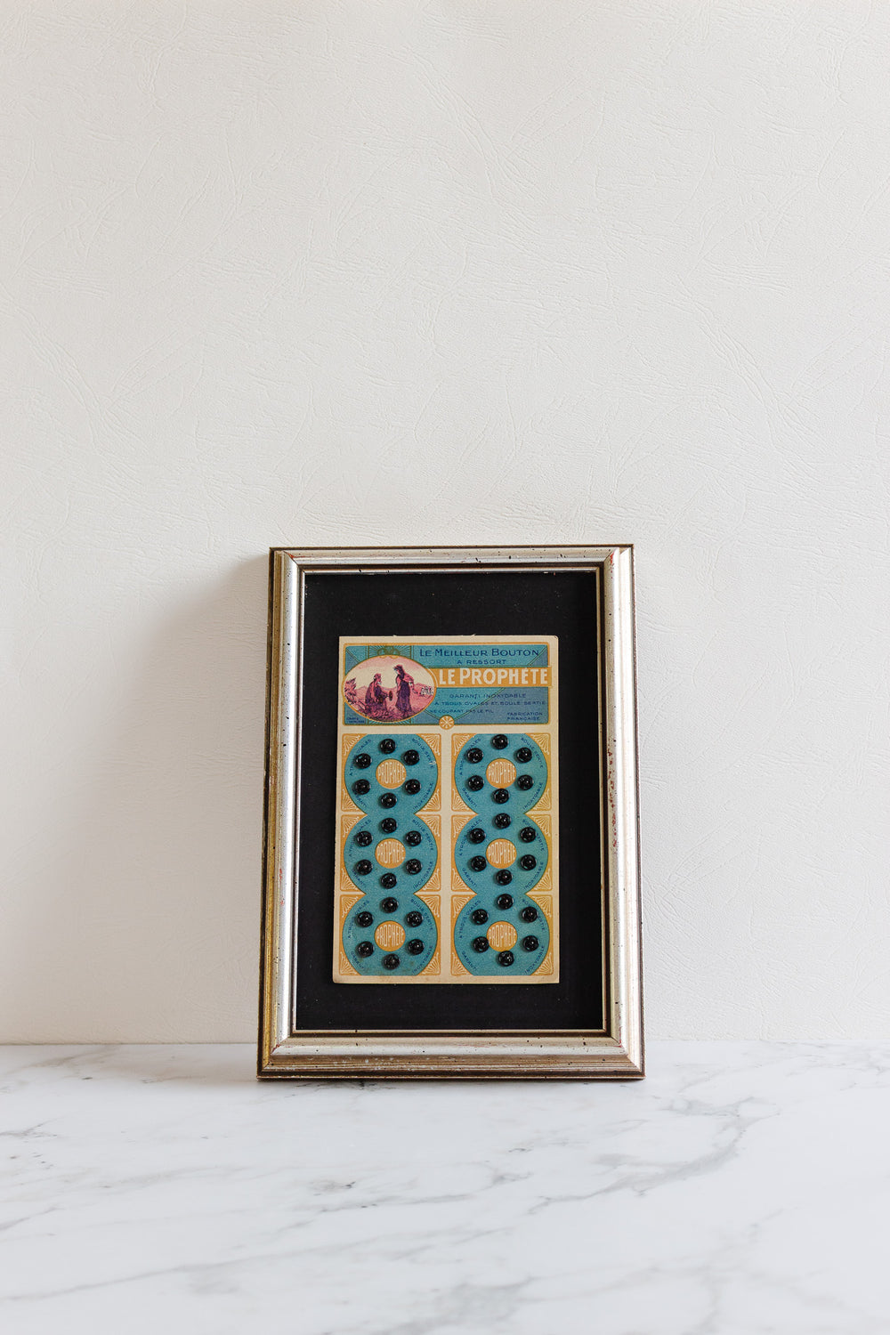 "le prophète" 1920s framed buttons