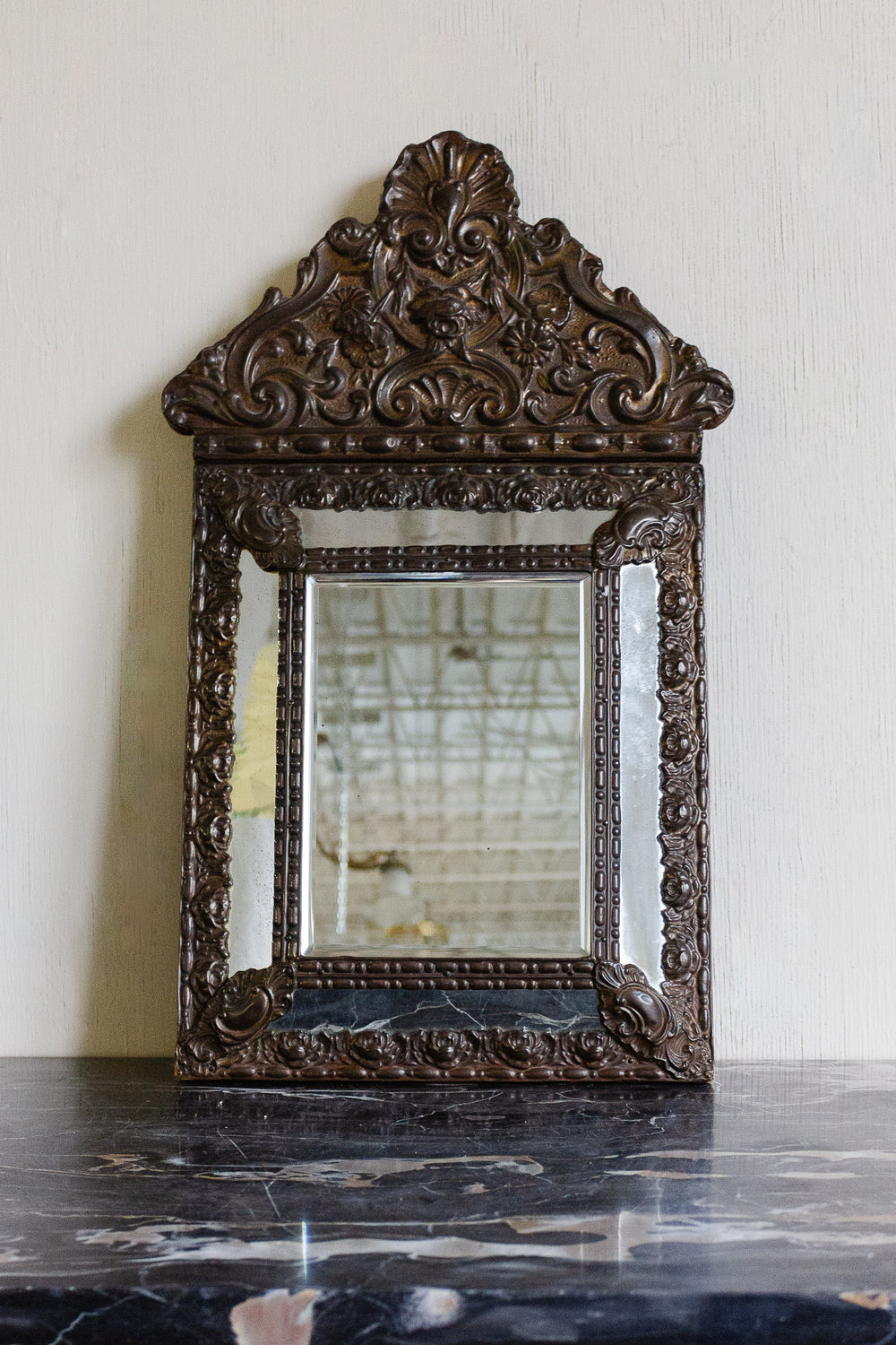 antique french repousse mirror with beveled glass