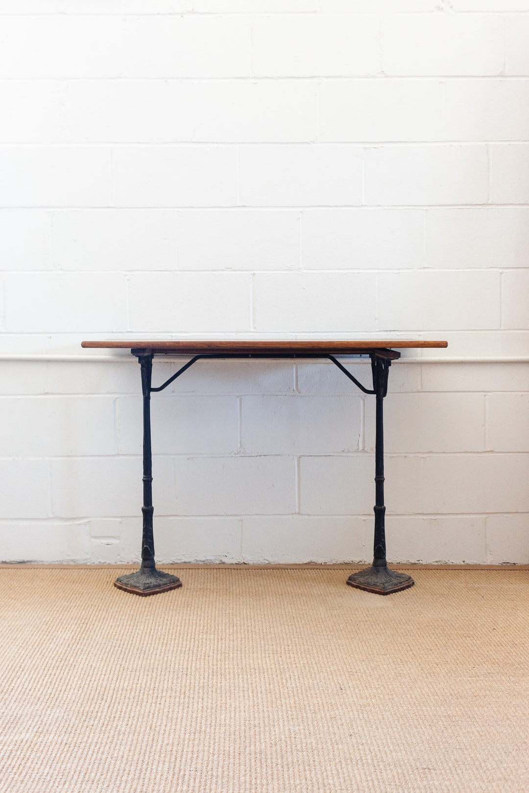 antique french bistro table with cast metal base
