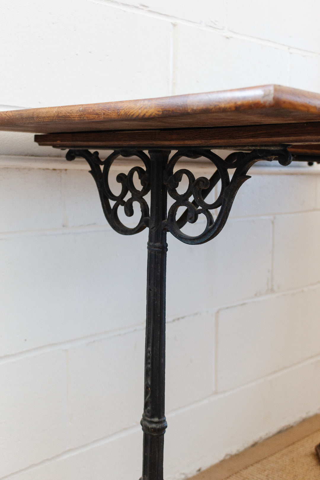 antique french bistro table with cast metal base