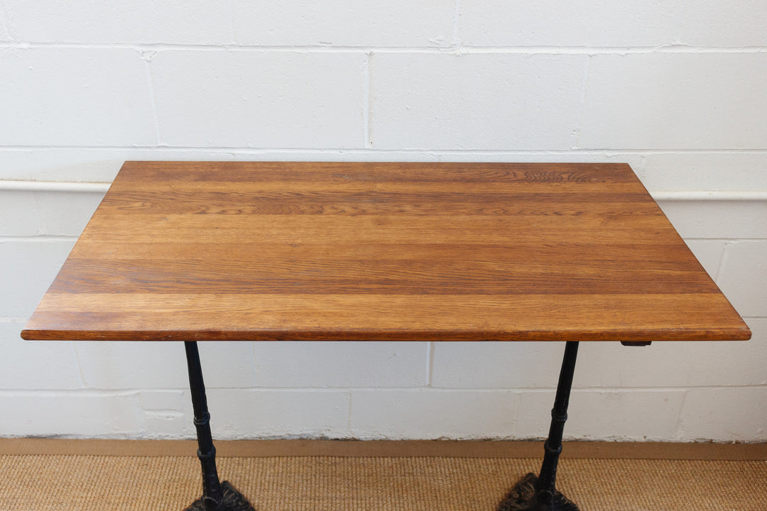 antique french bistro table with cast metal base