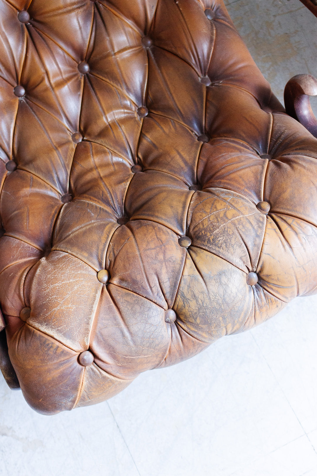 vintage English tufted leather armchair