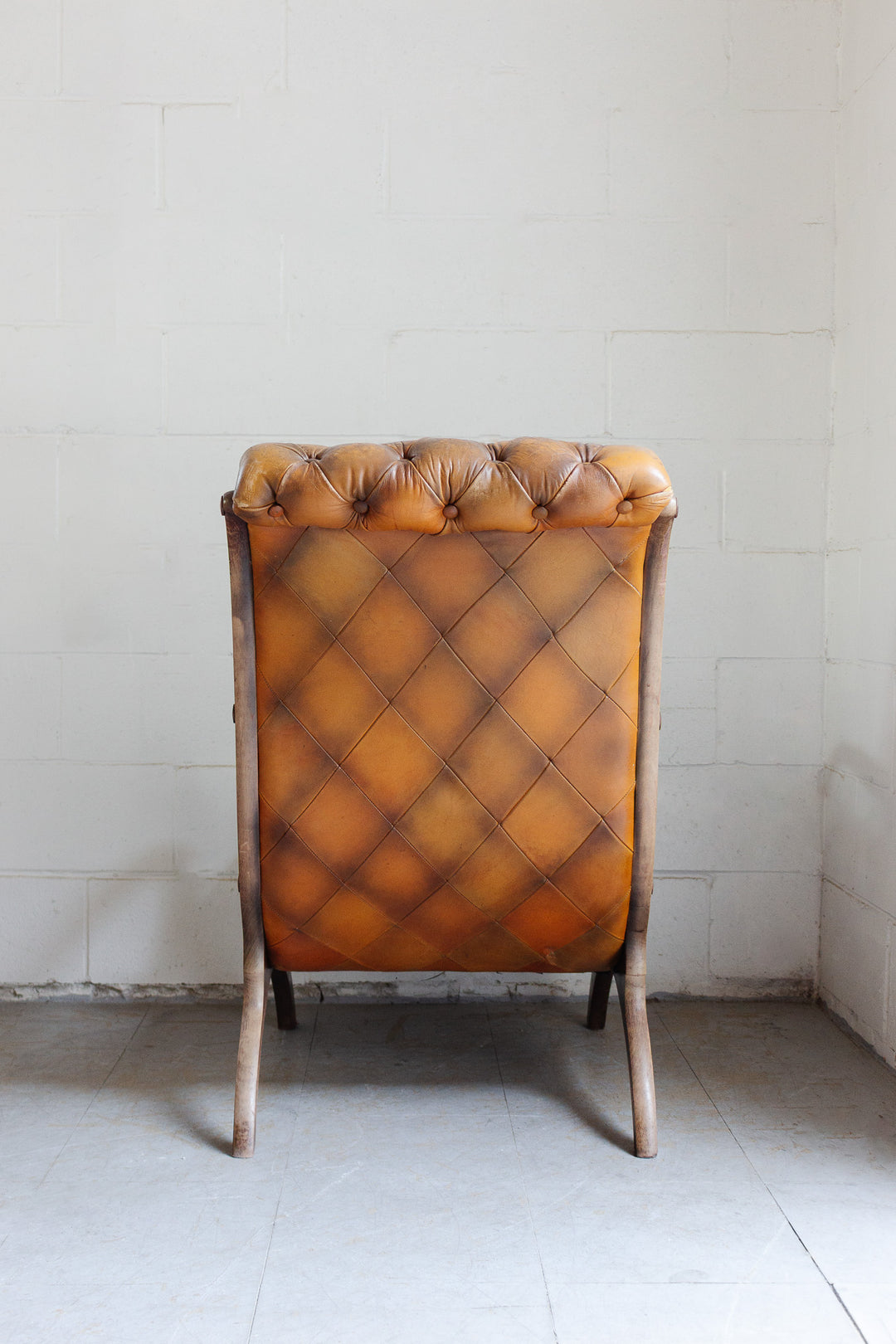 vintage English tufted leather armchair