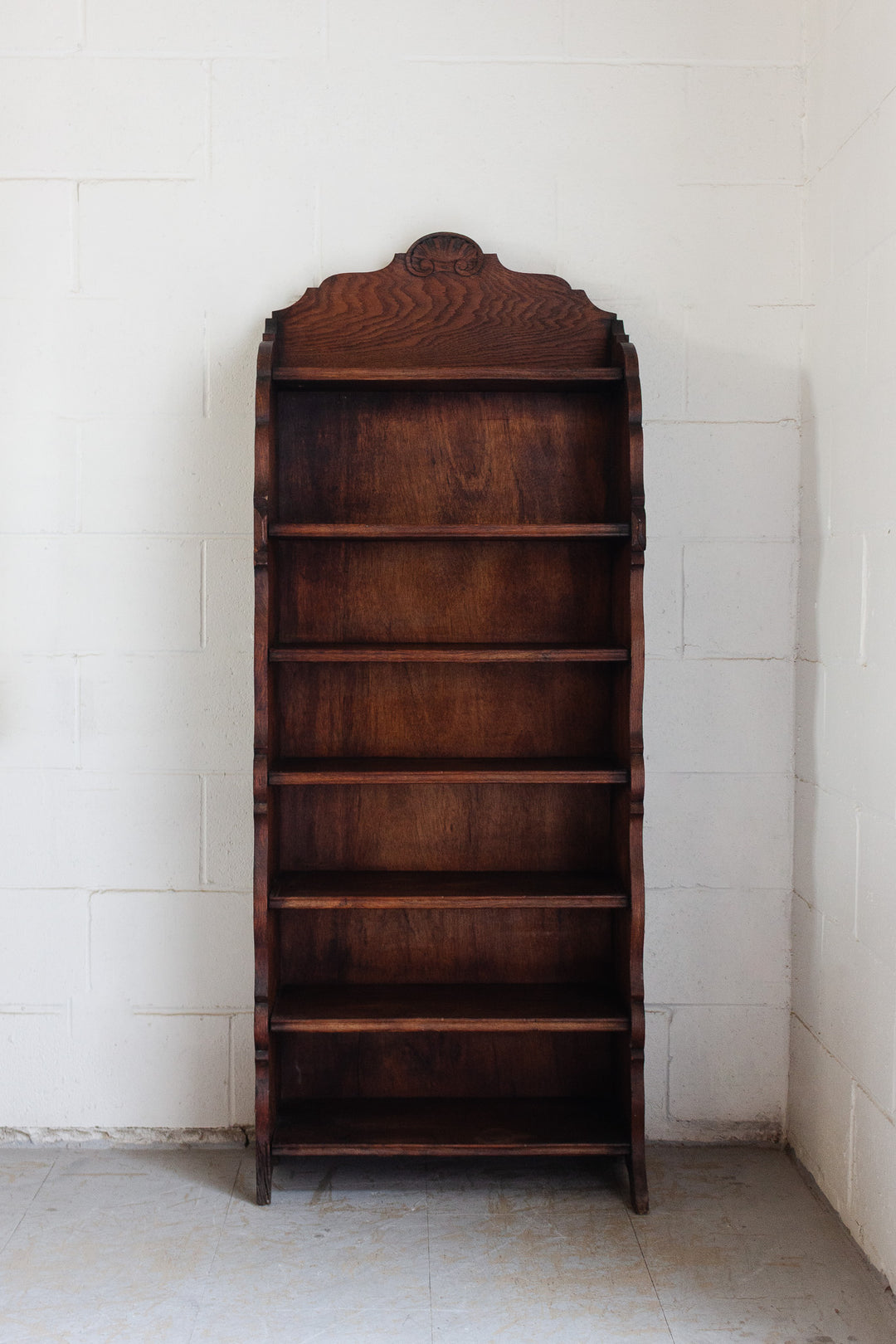 vintage french dark stained wood shelf with scalloped arch