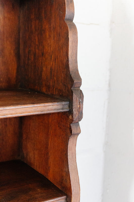 vintage french dark stained wood shelf with scalloped arch