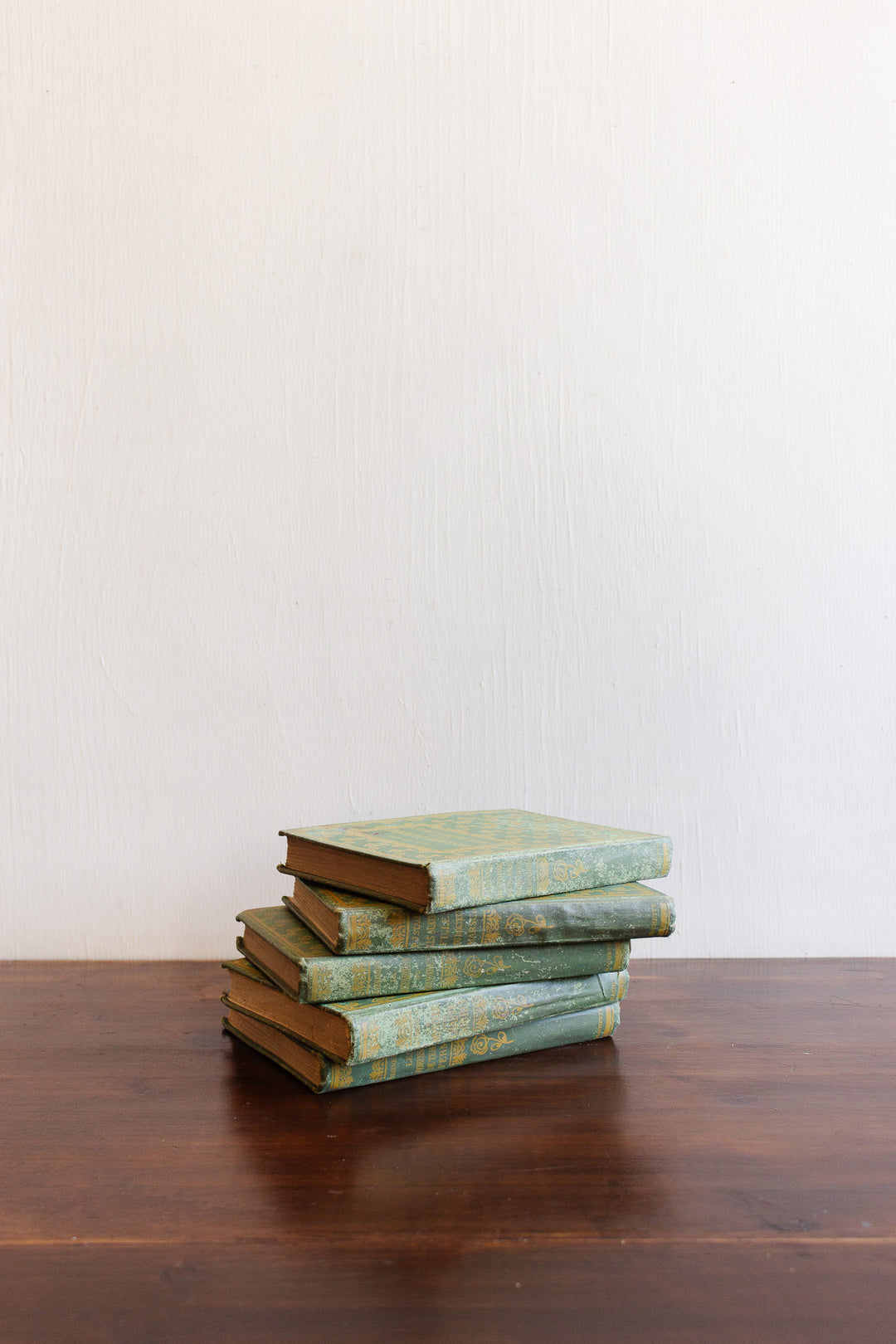 1923 green and gold decorative cloth "cartonnage" book set