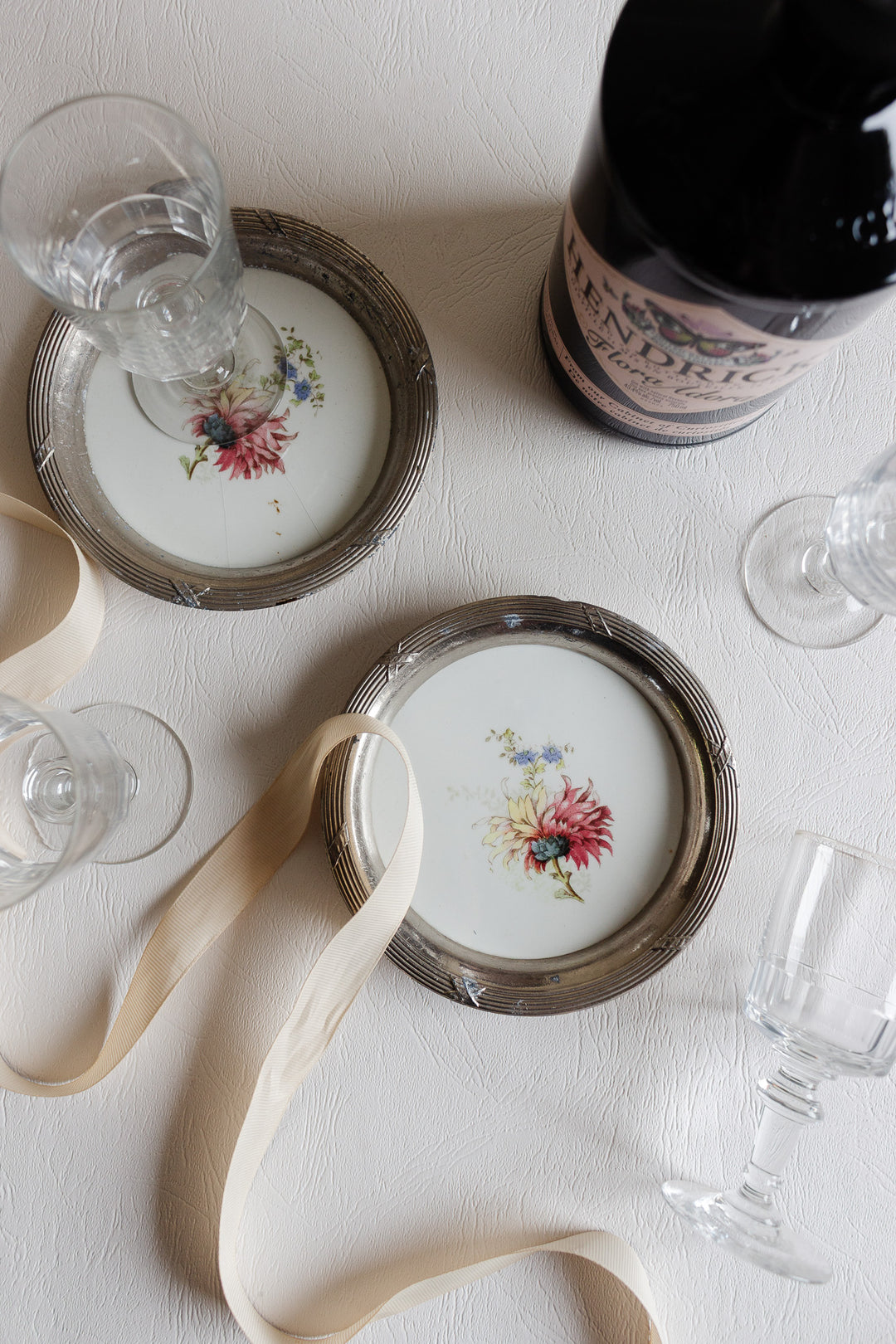 antique french porcelain and metal "sous verre" coaster set of two