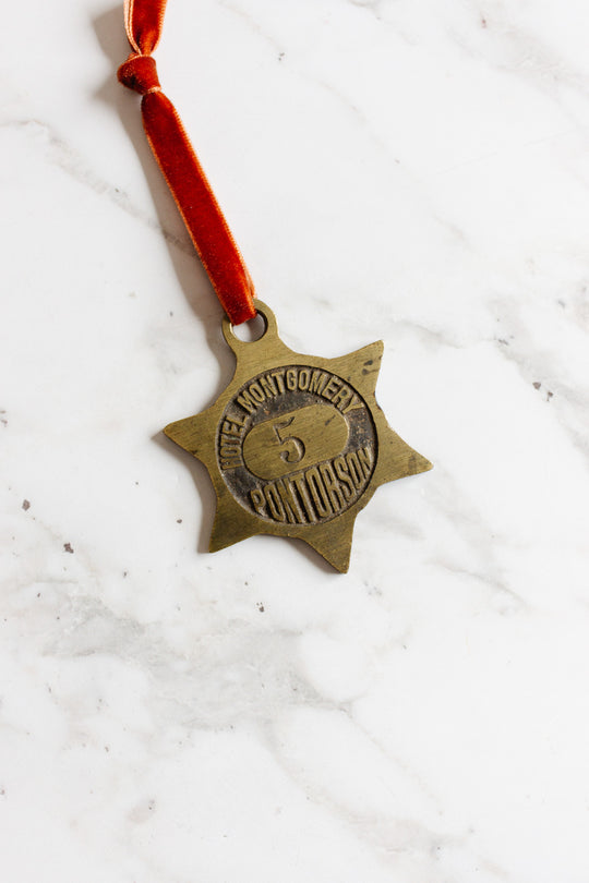 rare 1920s "hotel montgomery" étoile brass key fob