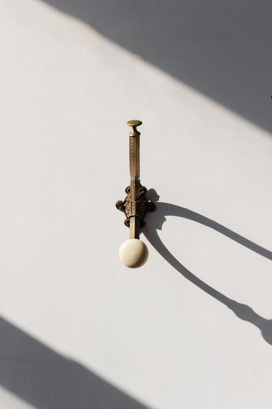 antique french embossed brass and porcelain wall hook