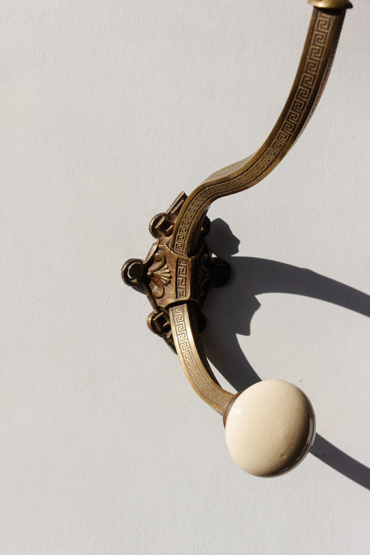 antique french embossed brass and porcelain wall hook