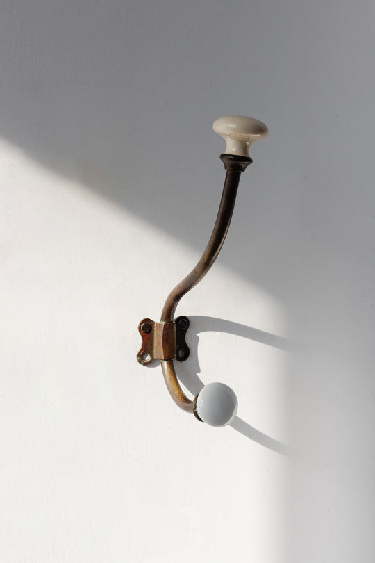 antique french cast iron and porcelain wall hook