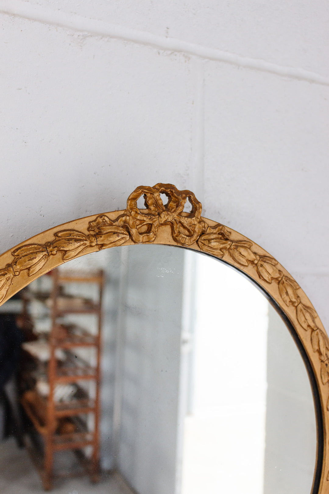 vintage Italian plaster mirror with bow cornice