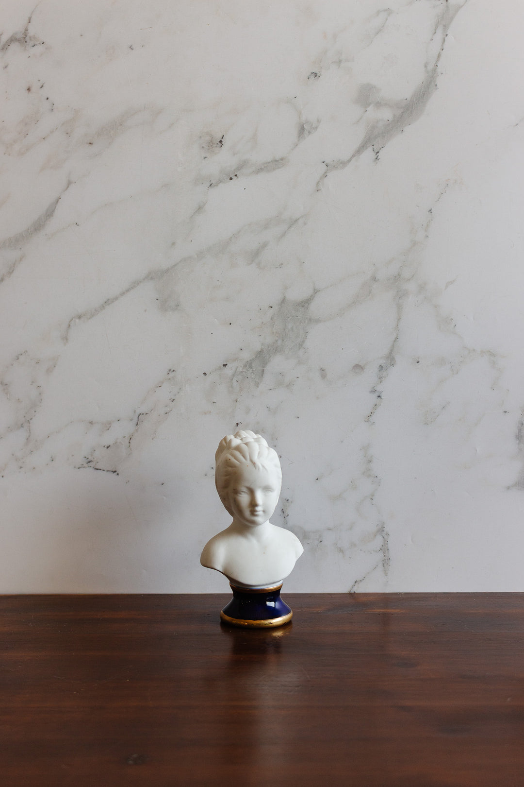 vintage french porcelain bust with blue pedestal