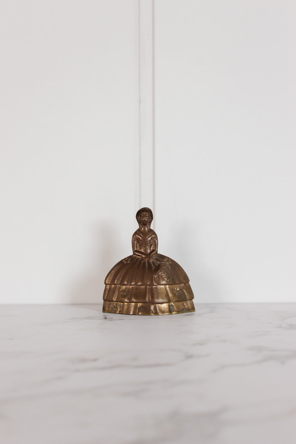 Vintage french brass “bell lady”