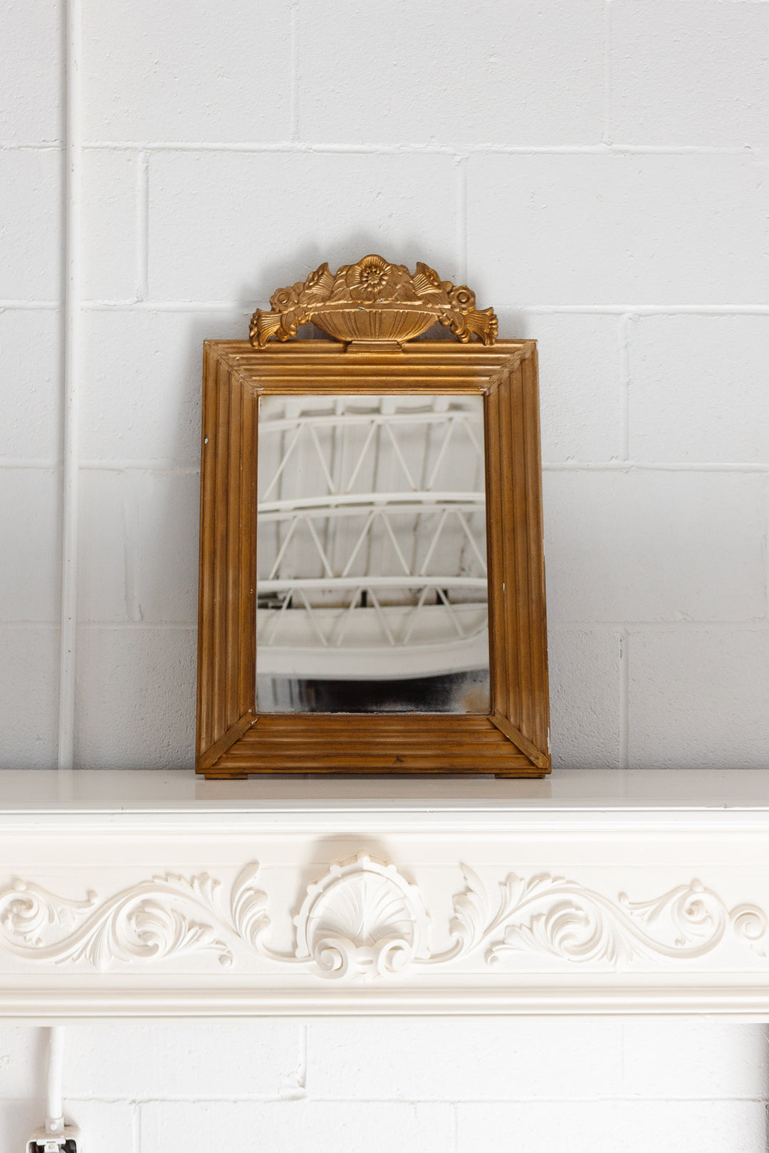 vintage French gilt wood mirror with flower basket cornice