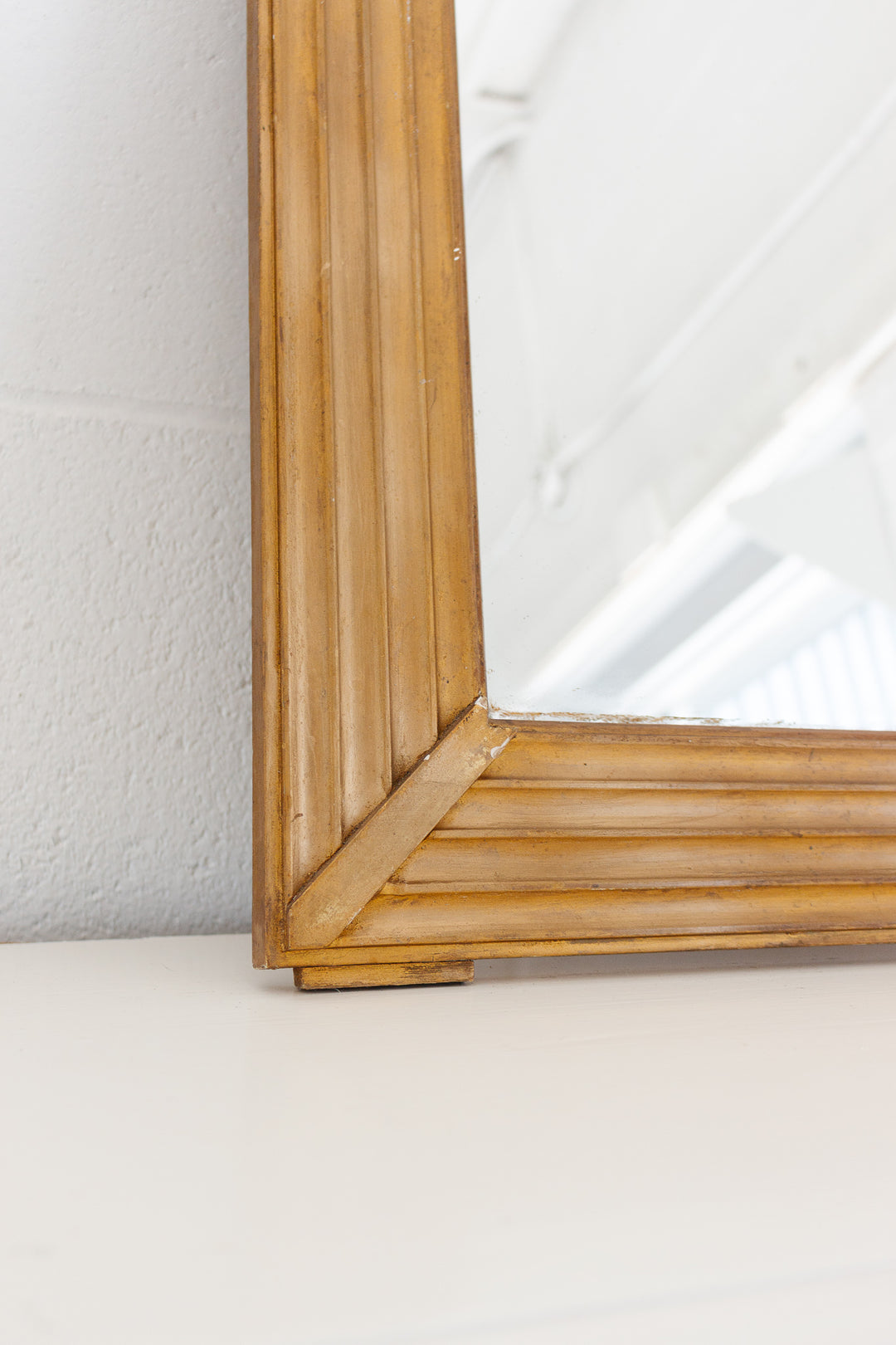 vintage French gilt wood mirror with flower basket cornice