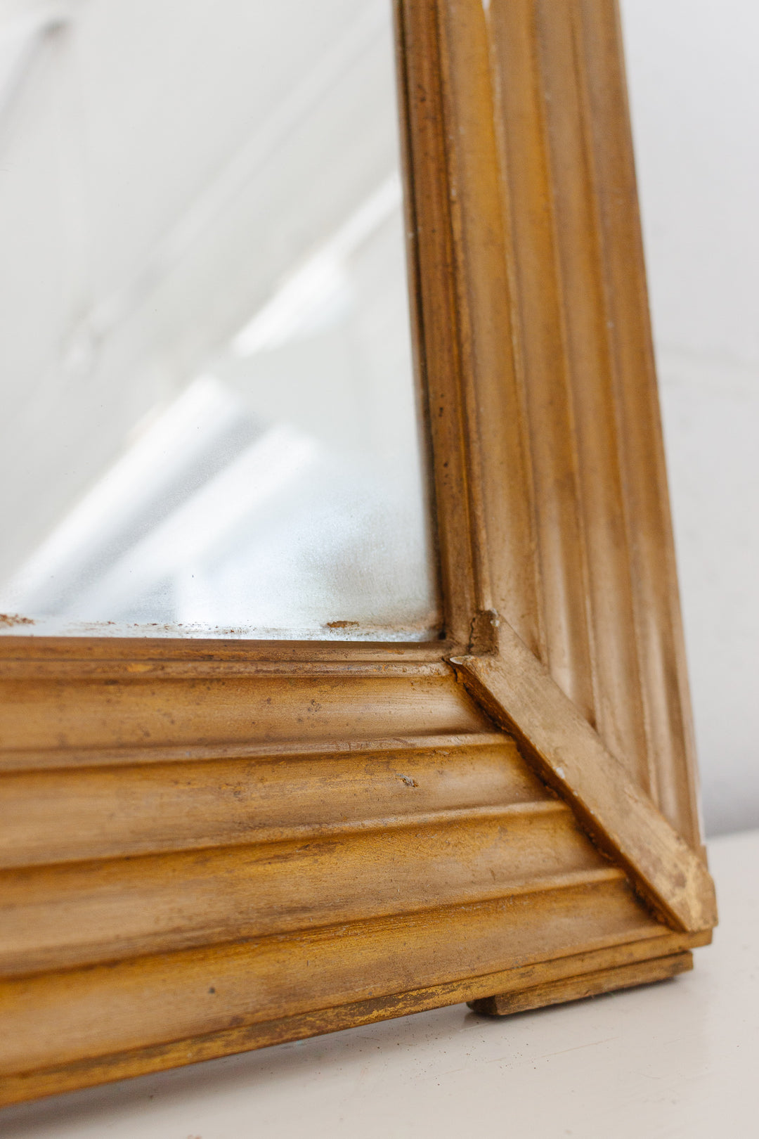 vintage French gilt wood mirror with flower basket cornice