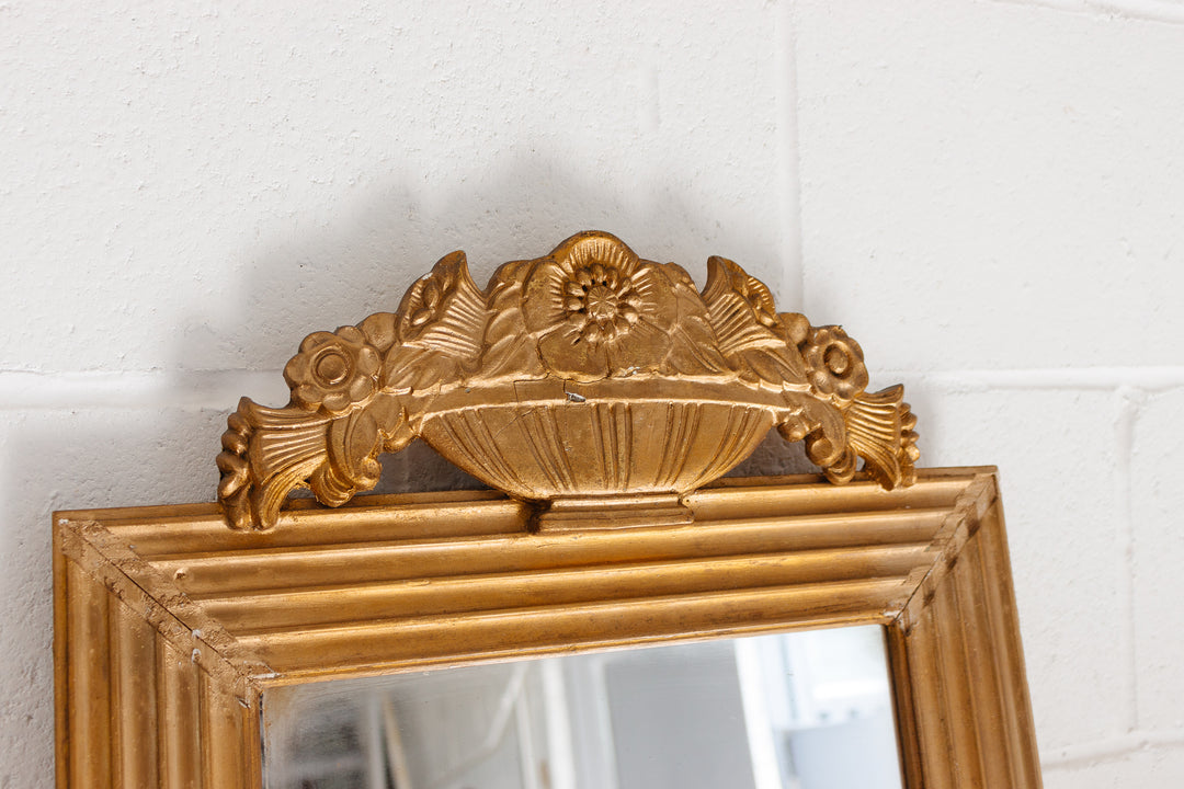 vintage French gilt wood mirror with flower basket cornice