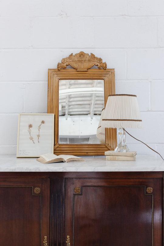 vintage French gilt wood mirror with flower basket cornice