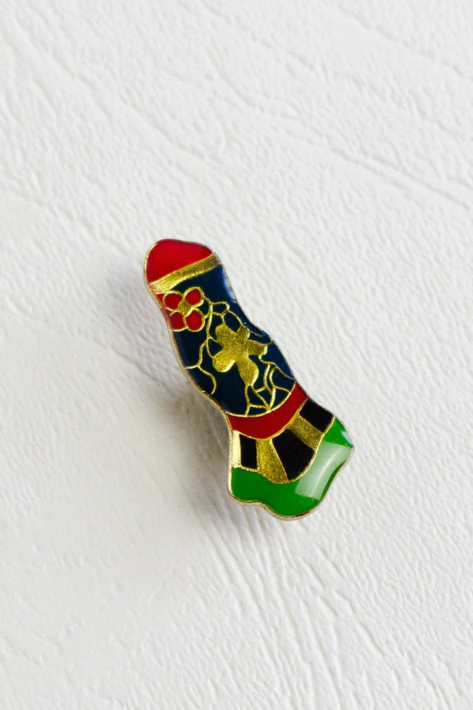 iconic feminist art jewelry pin by Niki de Saint Phalle