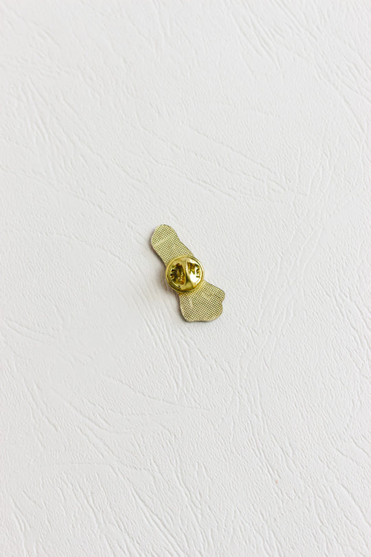 iconic feminist art jewelry pin by Niki de Saint Phalle
