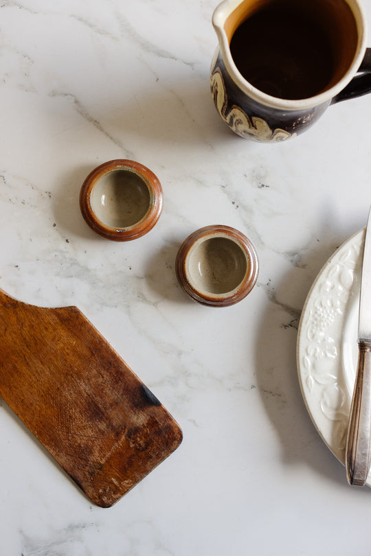 pair of vintage french stoneware butter pats