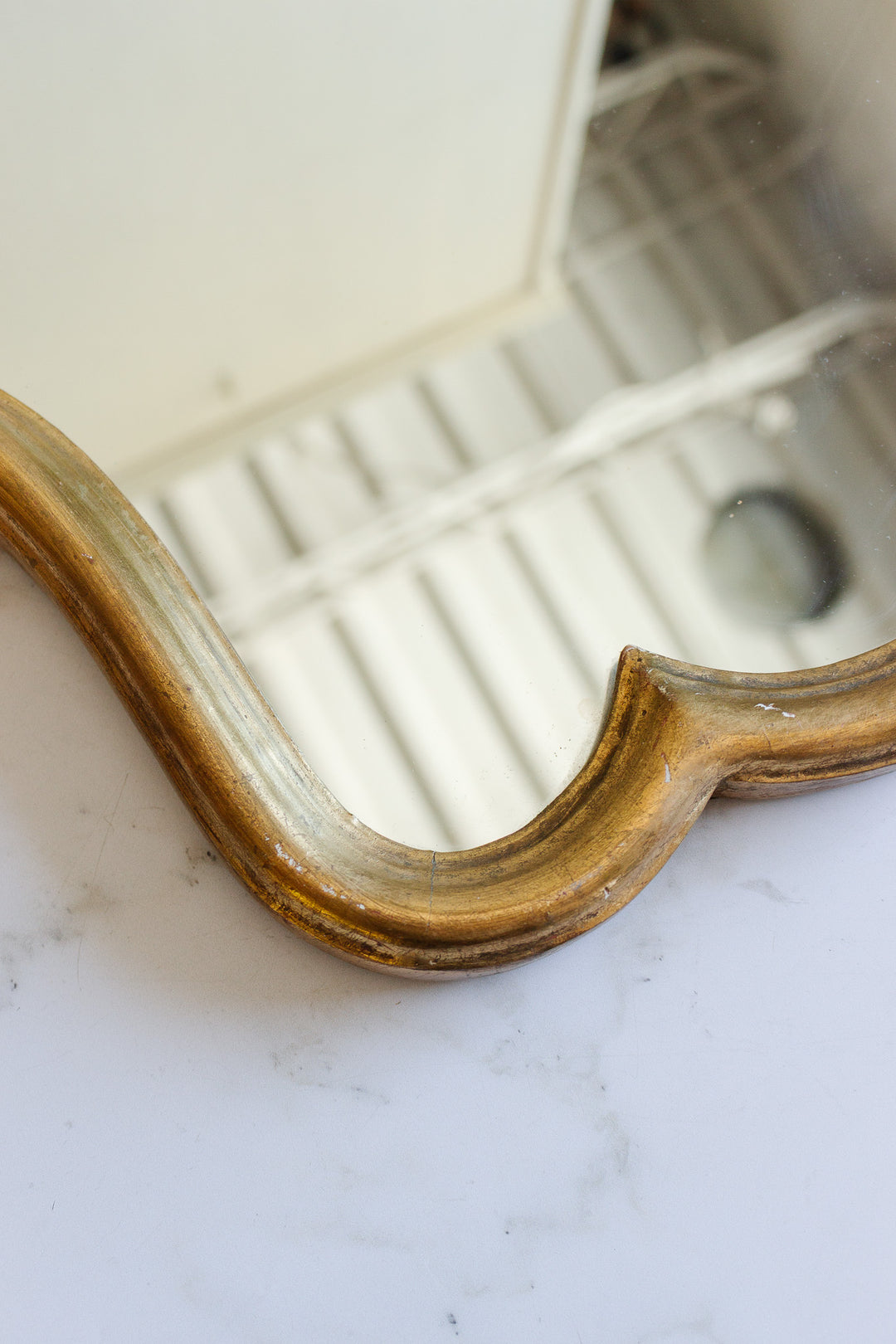 1970s Italian rococo style gilt mirror with scalloped edge