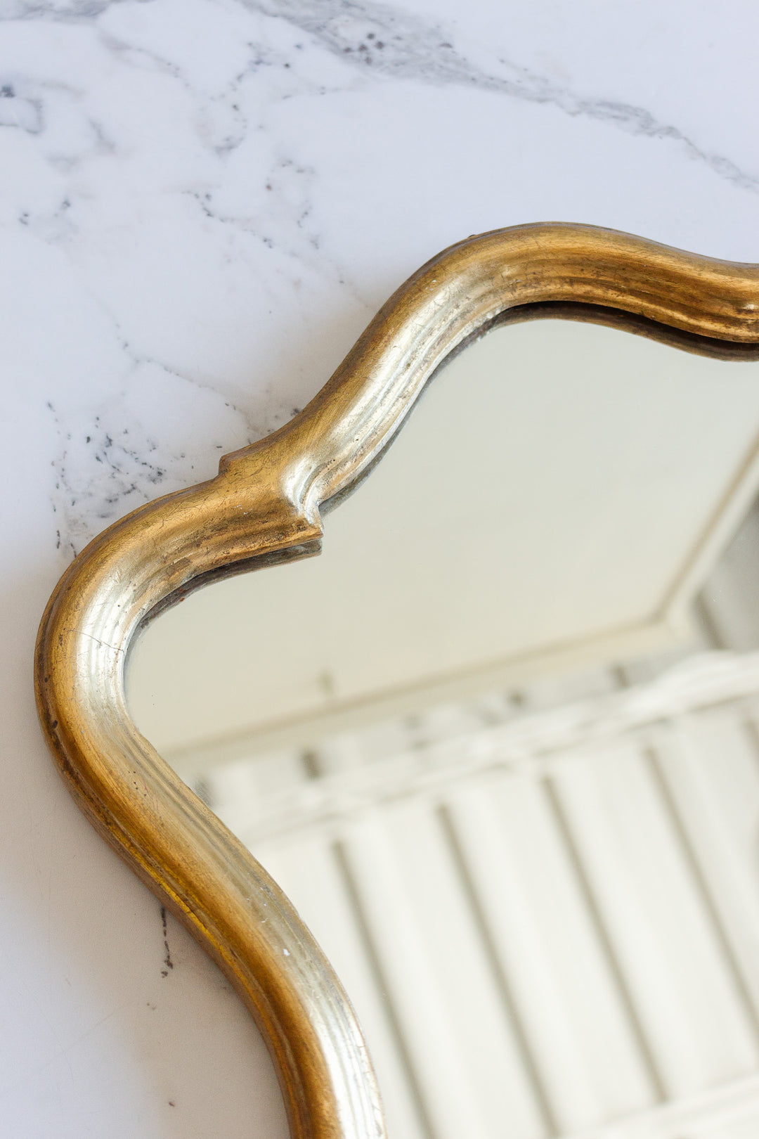1970s Italian rococo style gilt mirror with scalloped edge