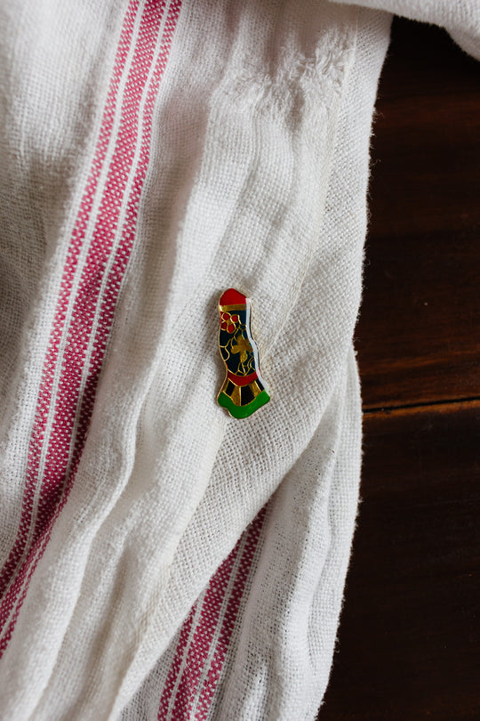 iconic feminist art jewelry pin by Niki de Saint Phalle