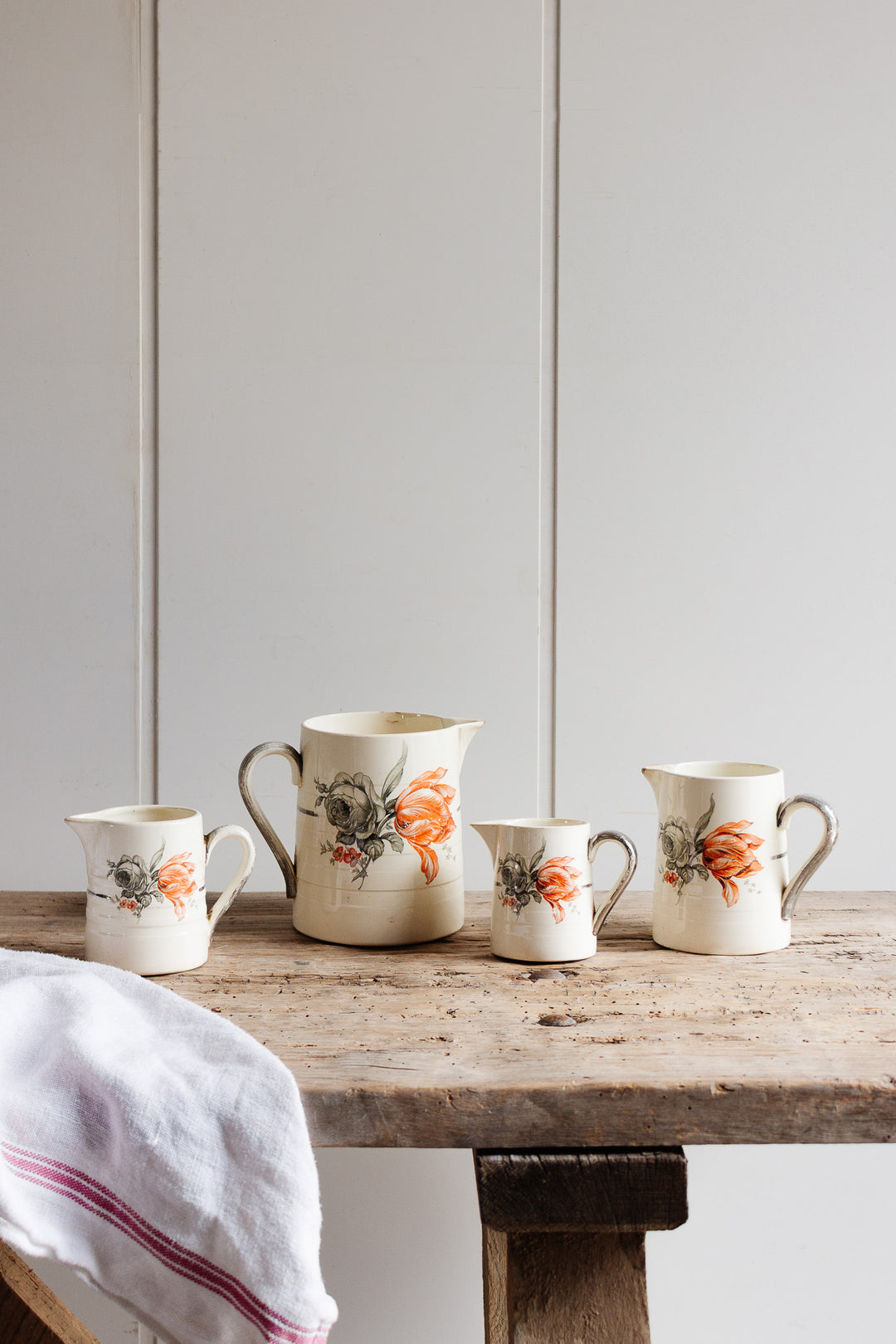 set of 4 antique faïence d'annaing transferware pitchers