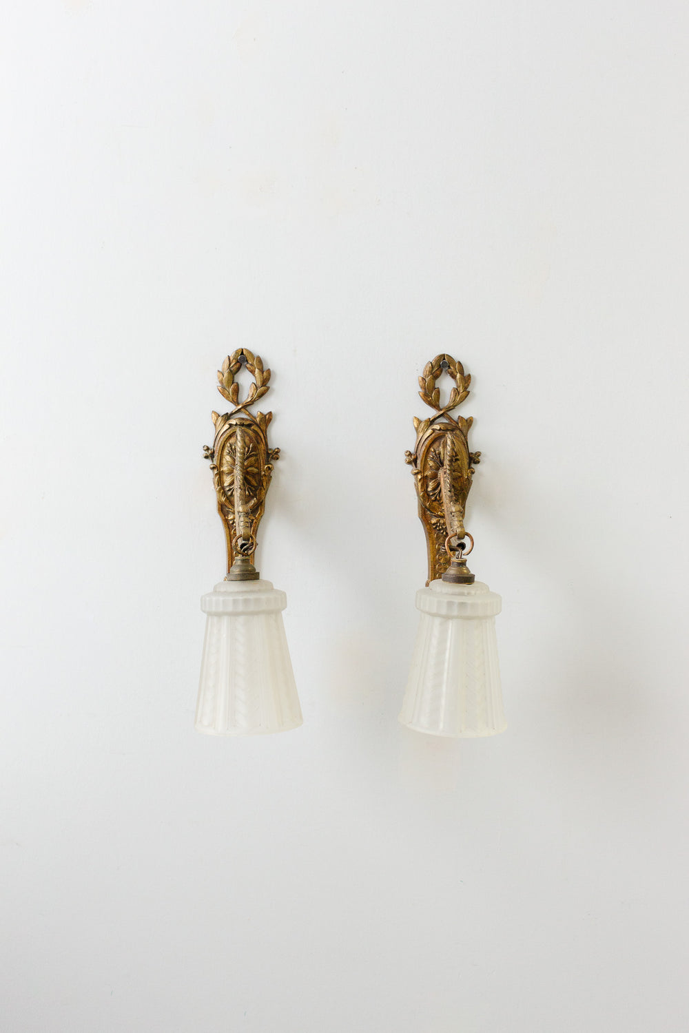 pair of art deco french brass wall sconces with glass shades