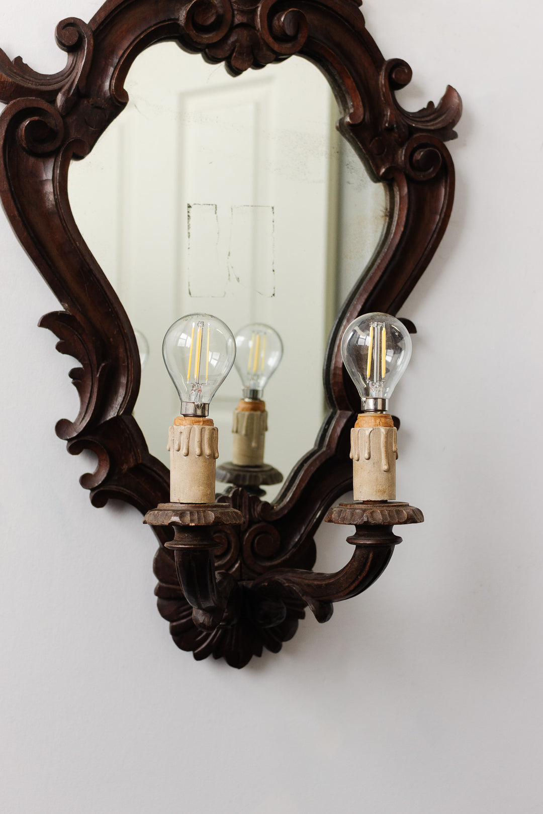 1920s French carved wood rococo style mirror sconce