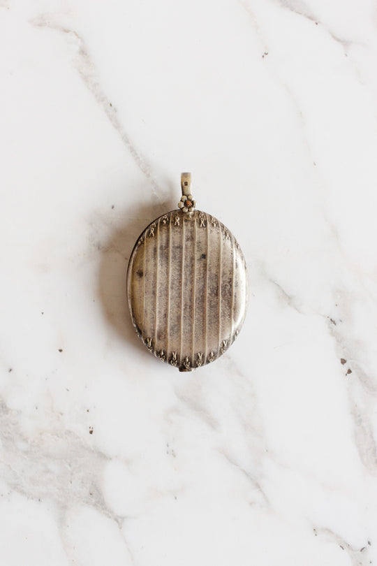 turn of the century French silver repousse art nouveau mirrored slide locket