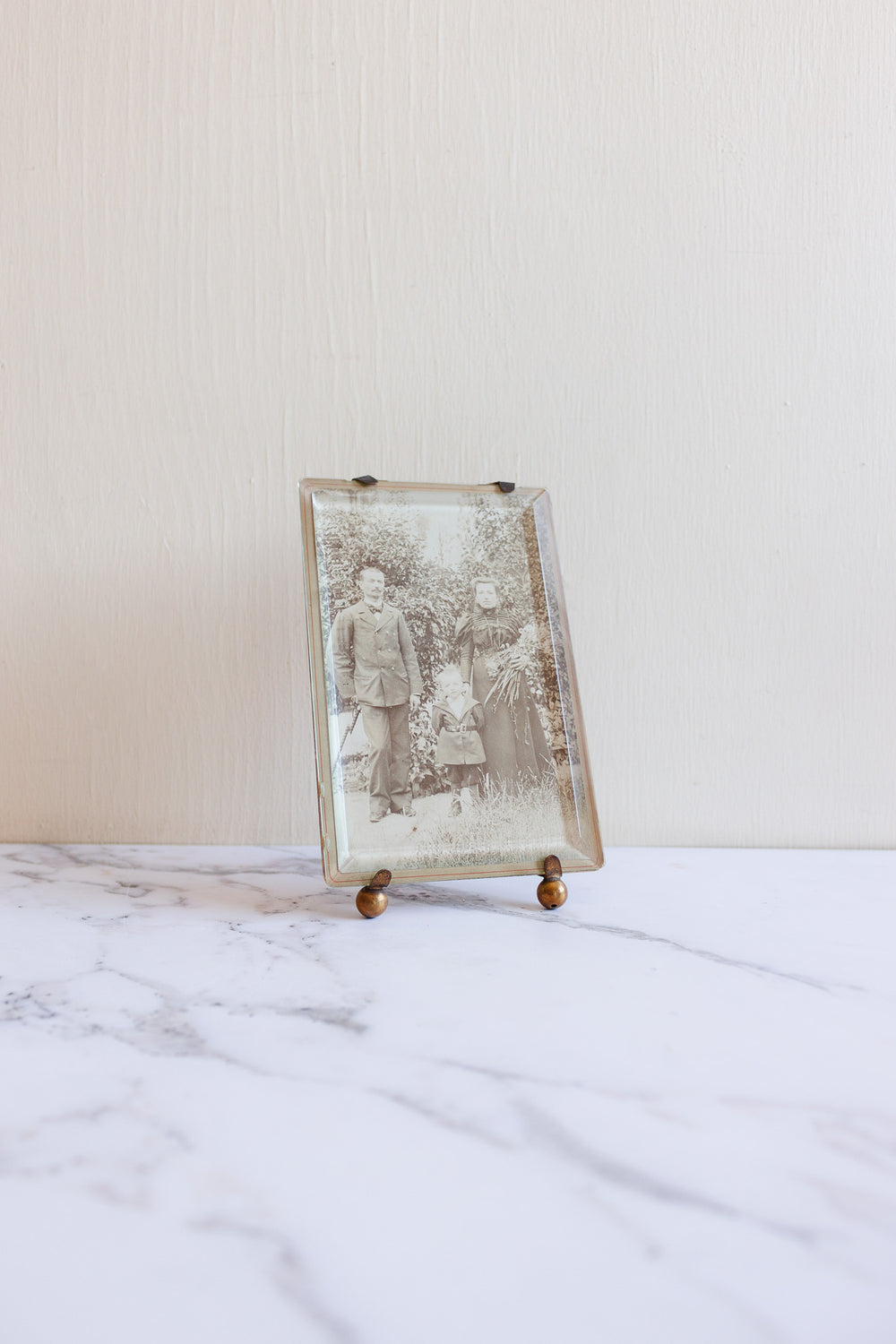 turn of the century French Napoleon III beveled glass & brass frame