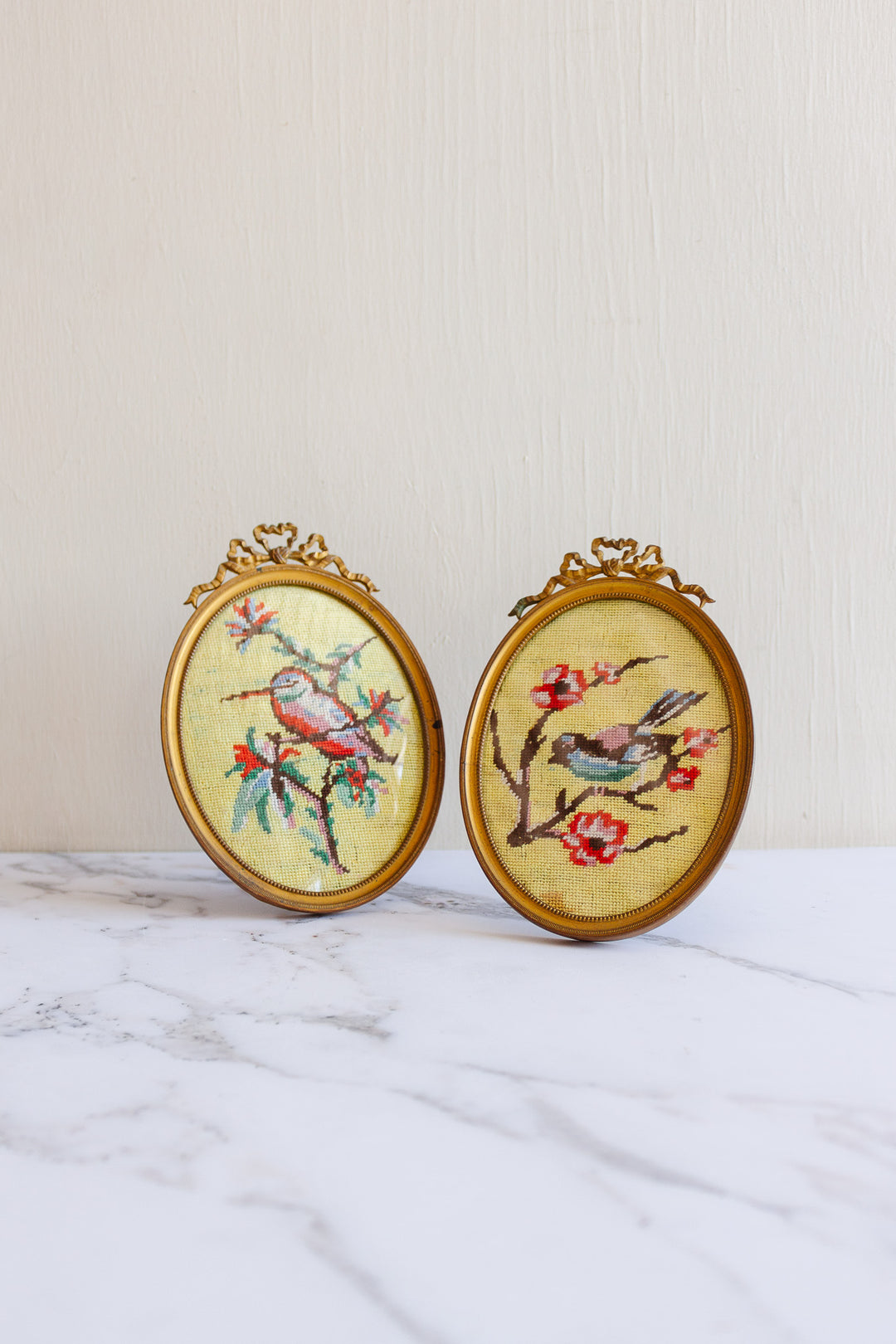 rare pair of turn of the century French Louis XVI brass frames with 1920s petit point "oiseaux chinoiserie"