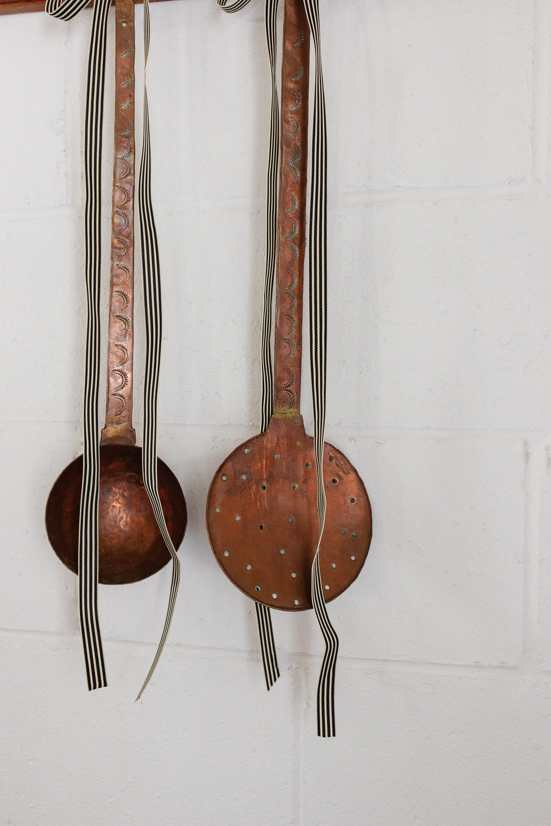 pair of antique French extra large hand forged copper utensils