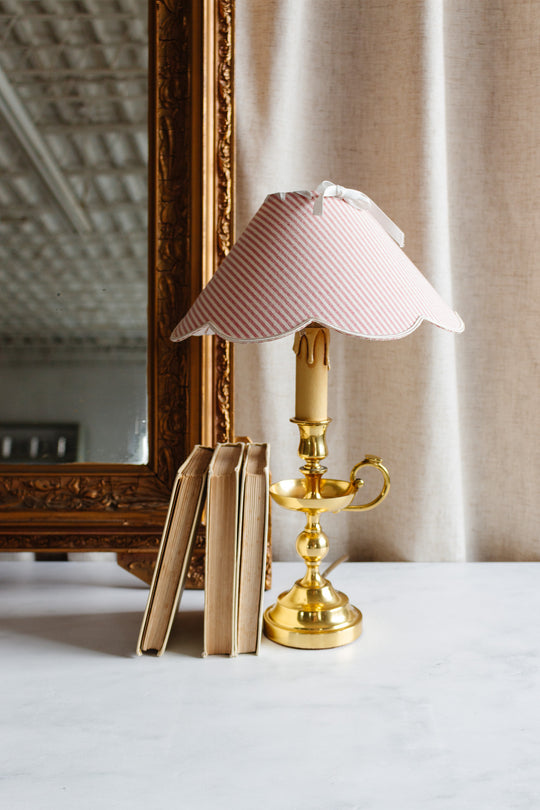 vintage French brass chamberstick lamp with scalloped ticking fabric shade