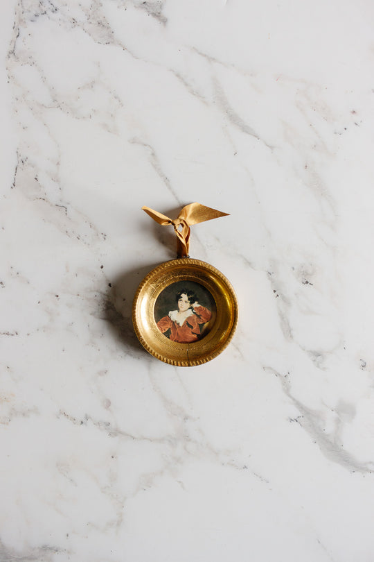 pair of vintage round florentine frames