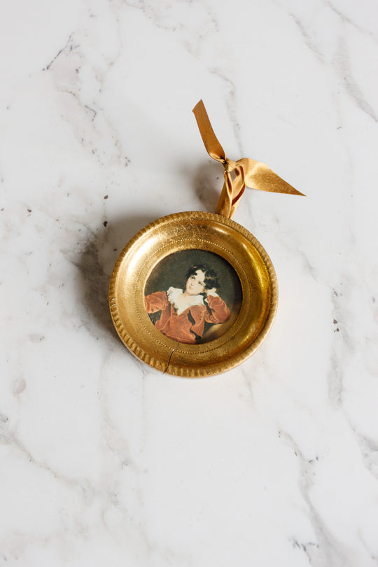 pair of vintage round florentine frames