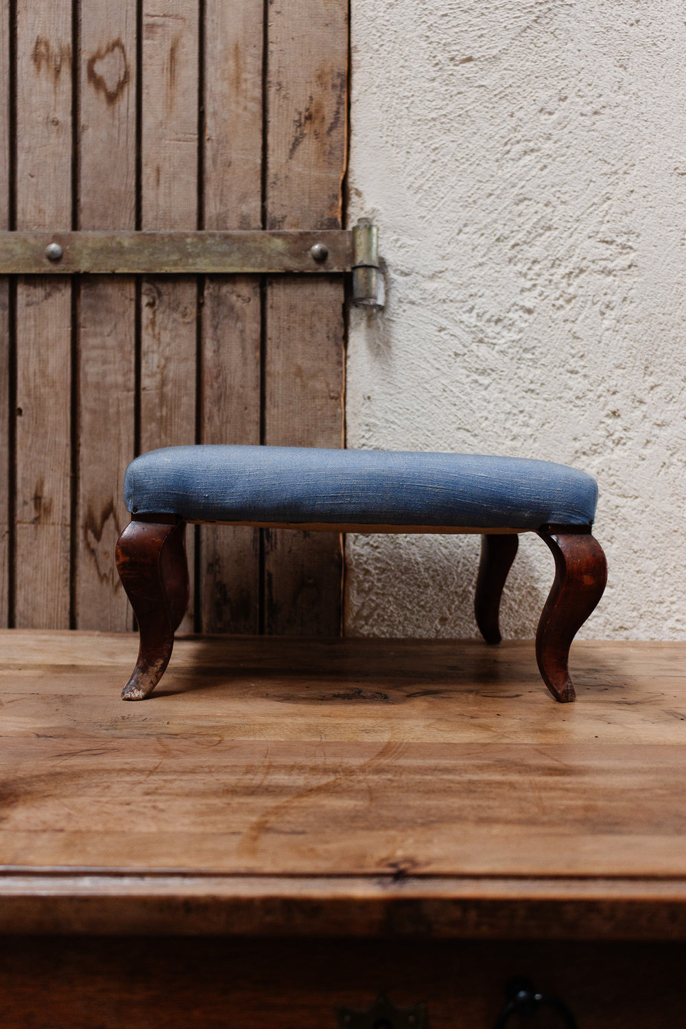 antique french blue fabric footstool with cabriole legs