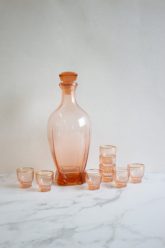 midcentury french pink rosaline glass decanter and gold rimmed glasses
