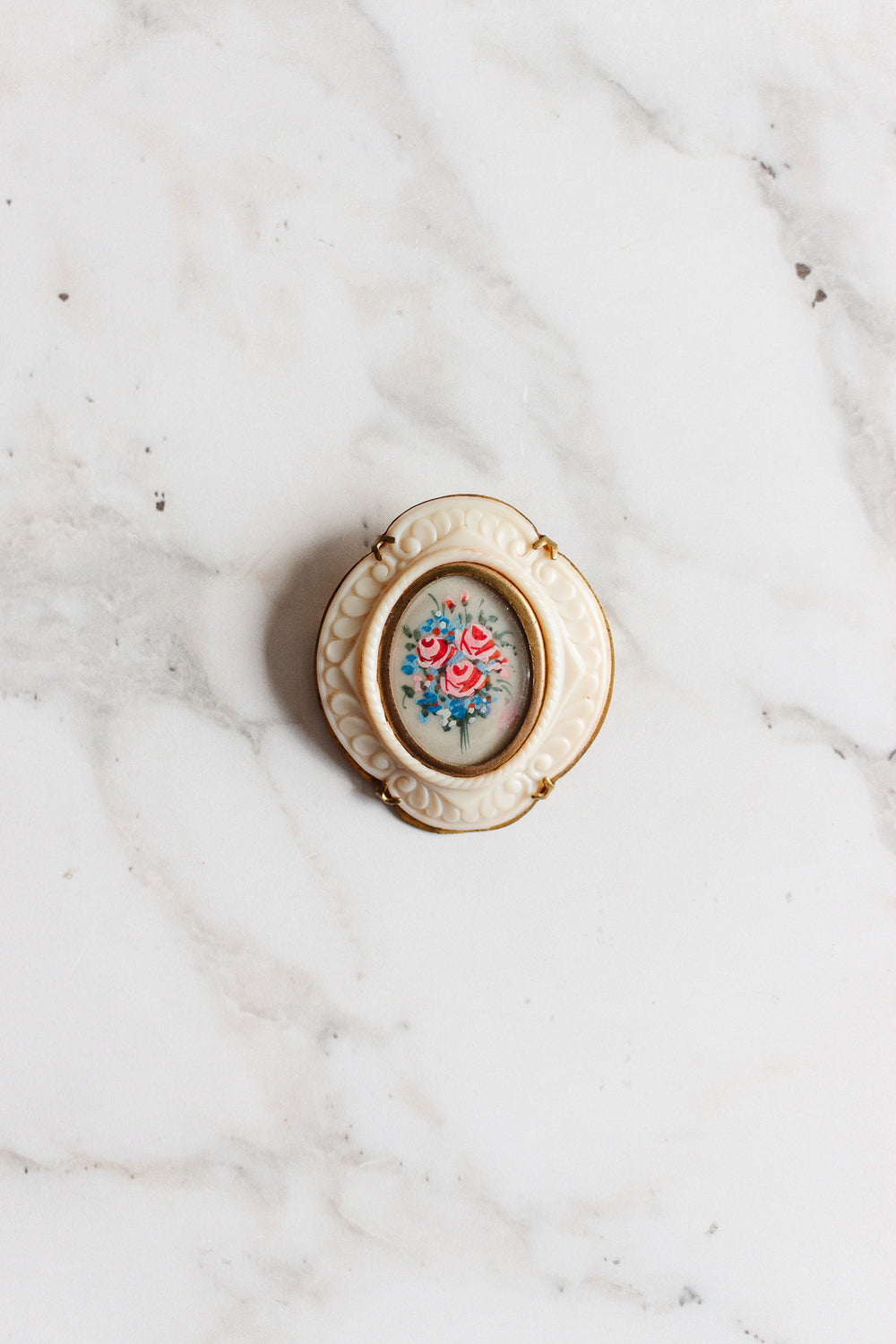 rare 1930s french hand painted floral pin with bakelite border