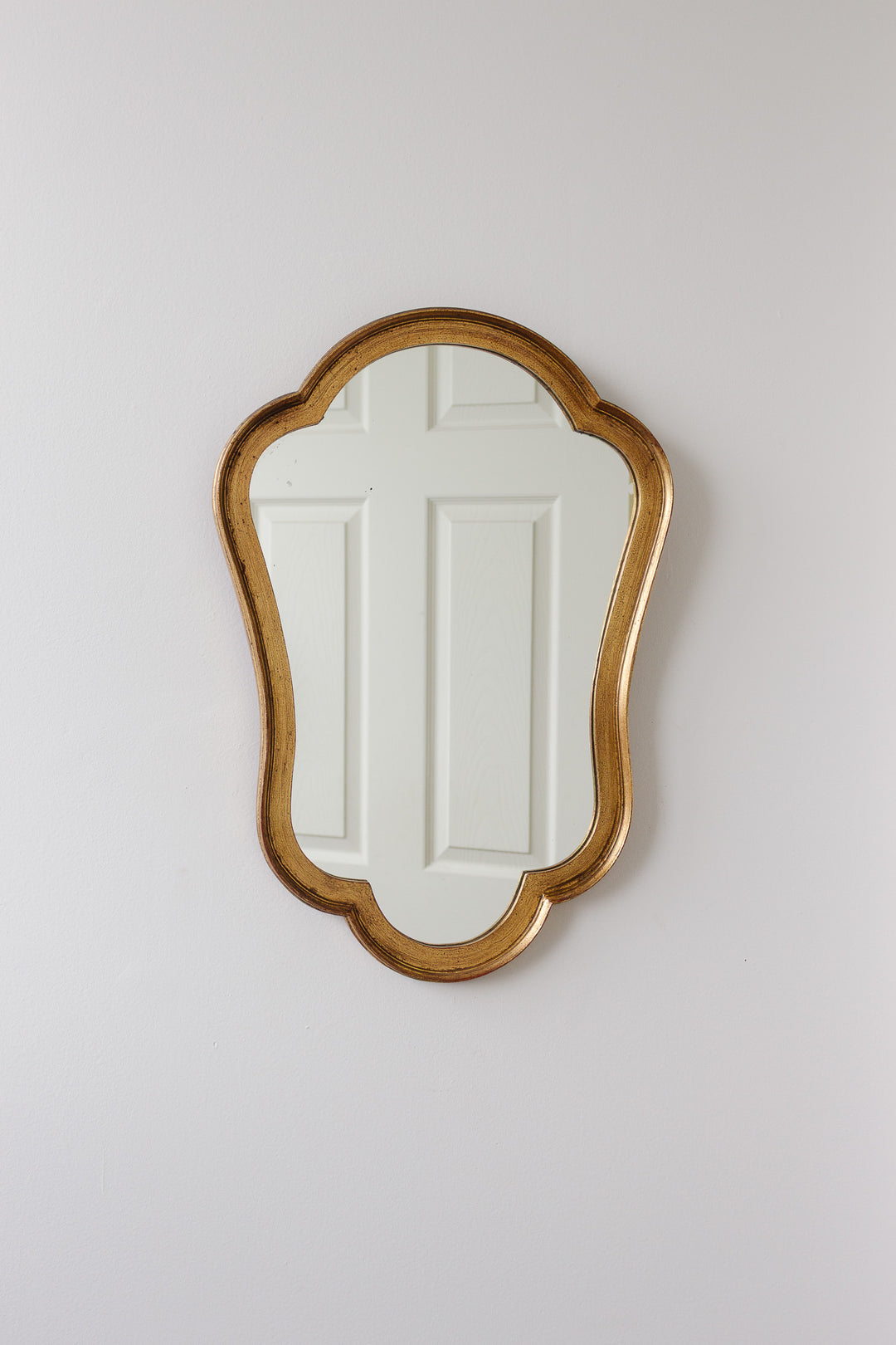 1970s Italian rococo style gilt mirror with scalloped edge
