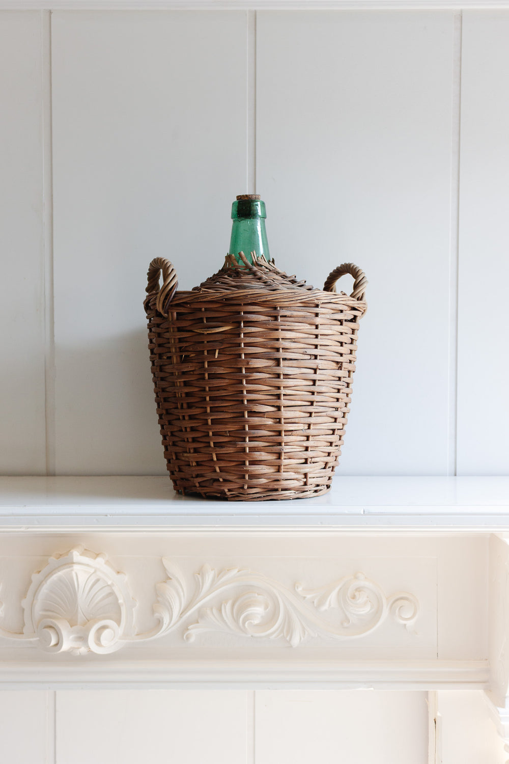 antique french wicker wrapped demijohn