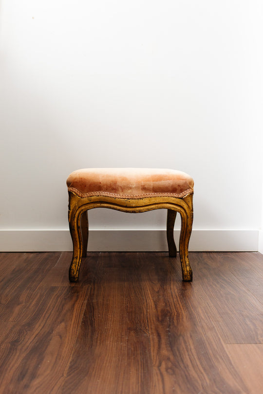 antique european footstool with pink velvet fabric
