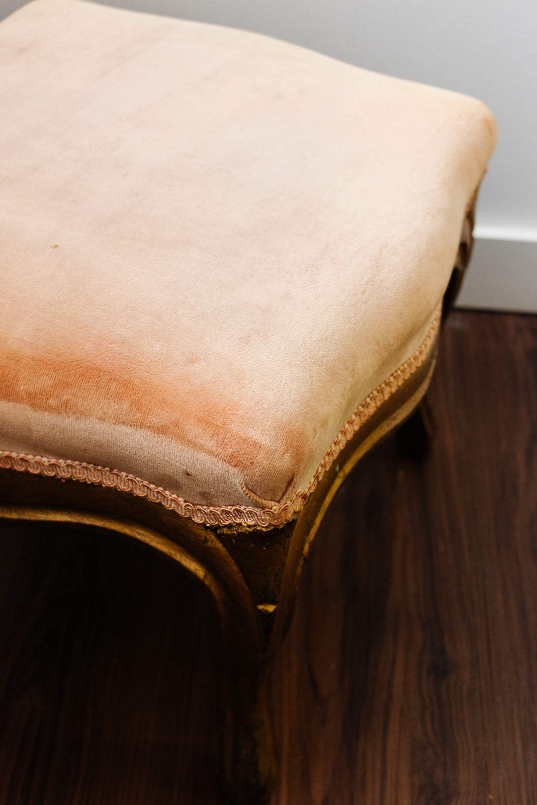 antique european footstool with pink velvet fabric