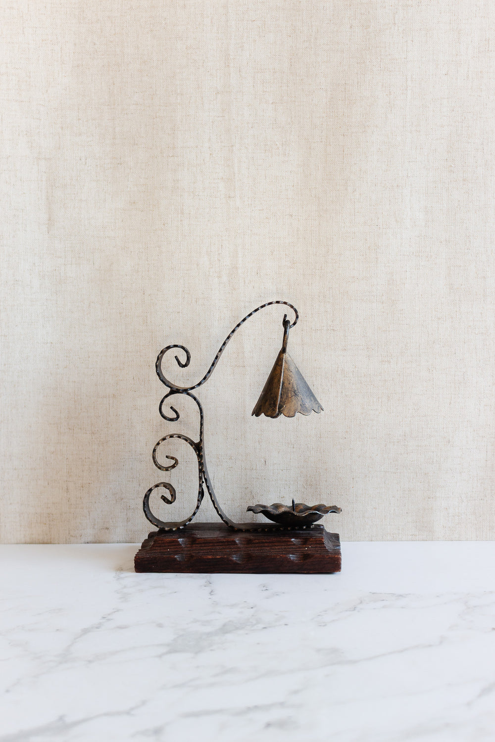 1970s french artisnal hand forged iron candlestick on wood base with snuffer