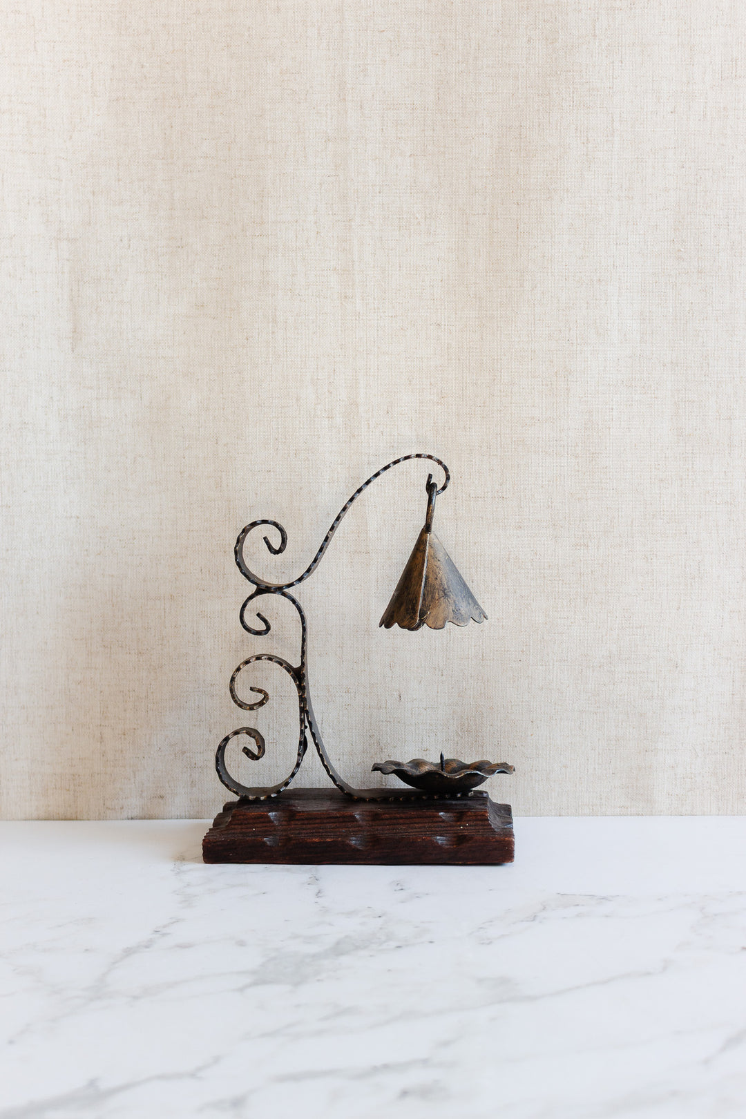 1970s french artisnal hand forged iron candlestick on wood base with snuffer