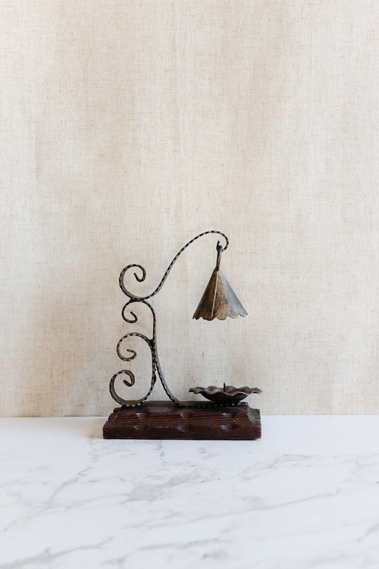 1970s french artisnal hand forged iron candlestick on wood base with snuffer